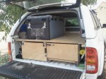 Waeco fridge mounted on slide out shelf on top of drawers in back of hilux