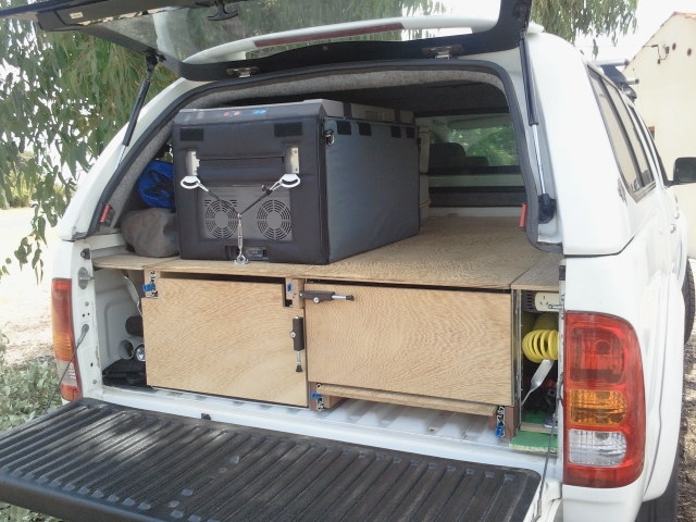 Waeco fridge mounted on slide out shelf on top of drawers in back of hilux