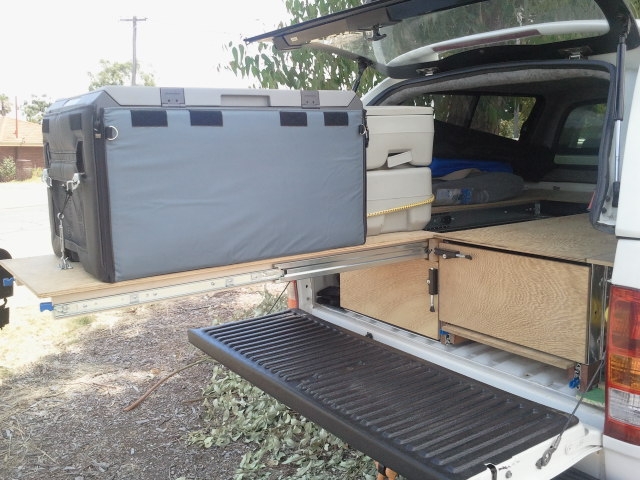 Fridge extended on slide out shelf from back of Hilux