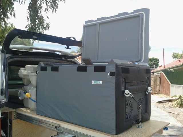 Fridge extended on slide out shelf from back of Hilux