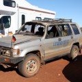 banged up 4WD parked at Uluru
