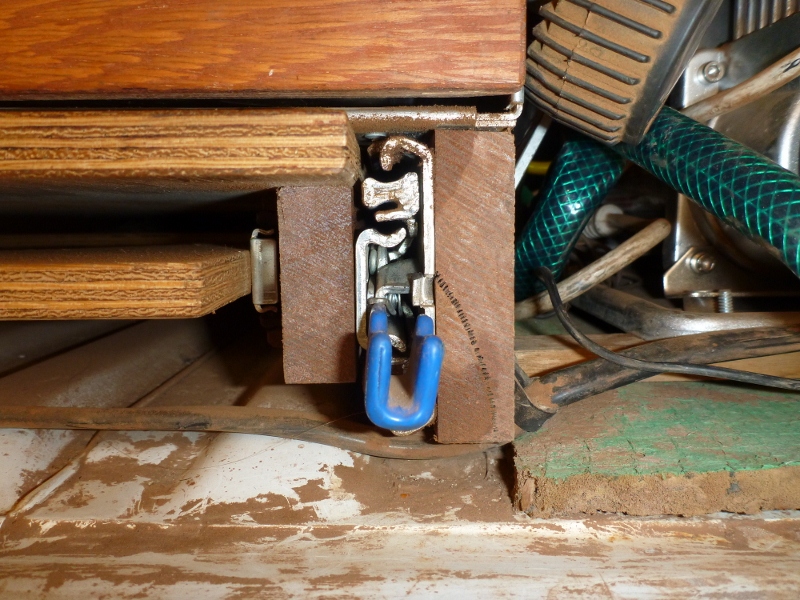 timber rails supporting work bench and storage drawers